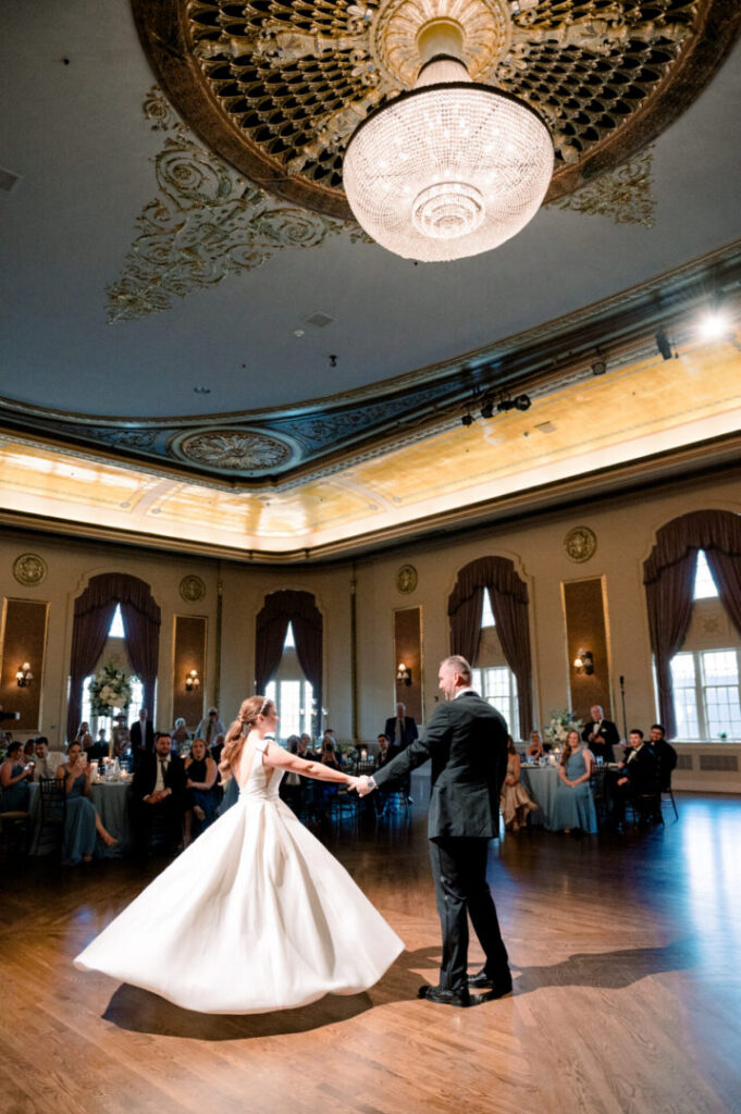 A bride and groom have a first dance in the Palais Royale ballroom