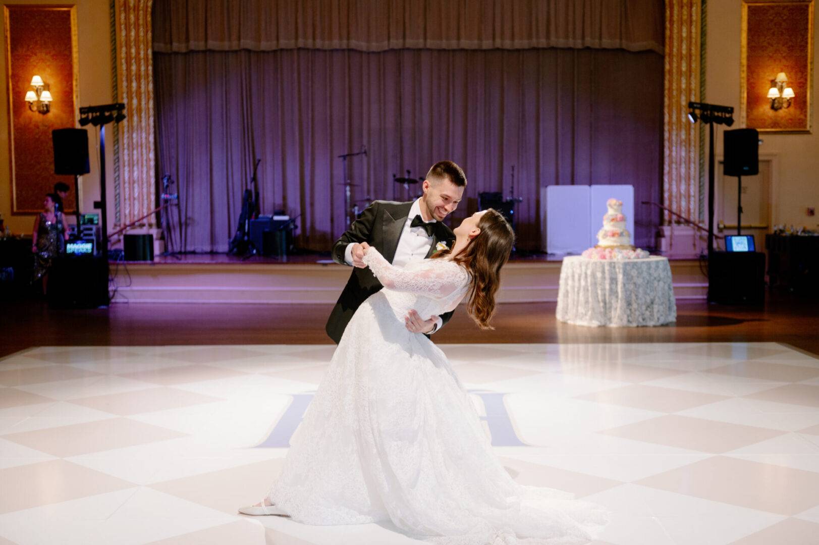 A bride and groom dance in the Palais Royale Ballroom
